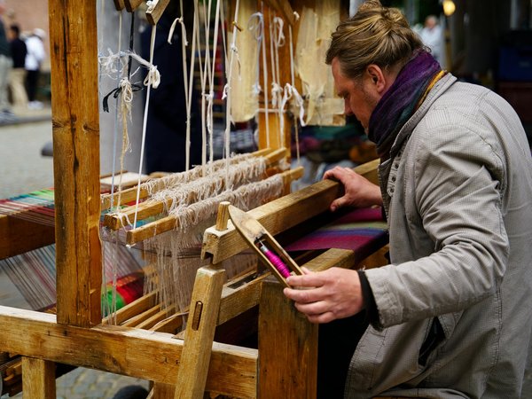 How can tourists engage in hands-on workshops about traditional British textile dyeing techniques?